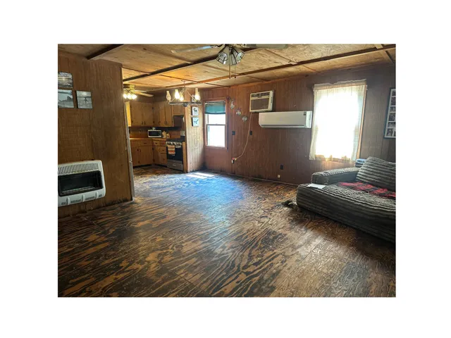 a living room with a fireplace and a flat screen tv