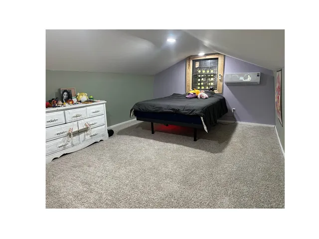 a kitchen with a refrigerator and window