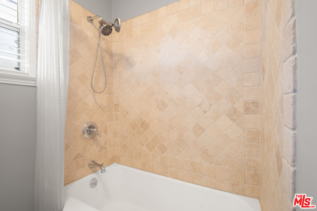 6218 Balcom Avenue Encino, CA 91316 - Photo 11 of 22 a bathroom with a shower and a bathtub