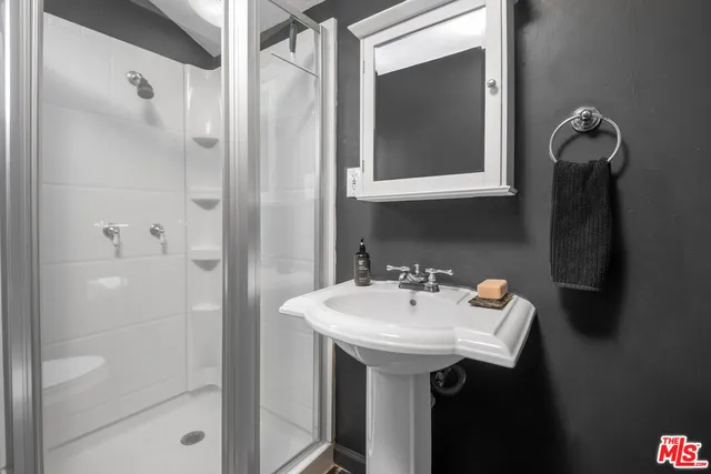 a bathroom with a sink and mirror