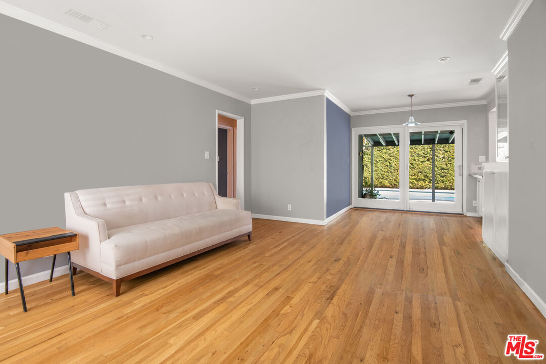 6218 Balcom Avenue Encino, CA 91316 - Photo 5 of 22 a living room with a bed furniture and a window