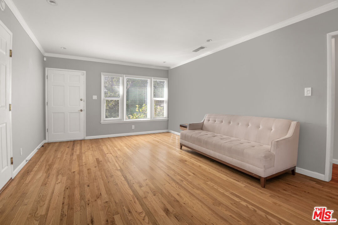 6218 Balcom Avenue Encino, CA 91316 - Photo 7 of 22 a living room with couch and wooden floor