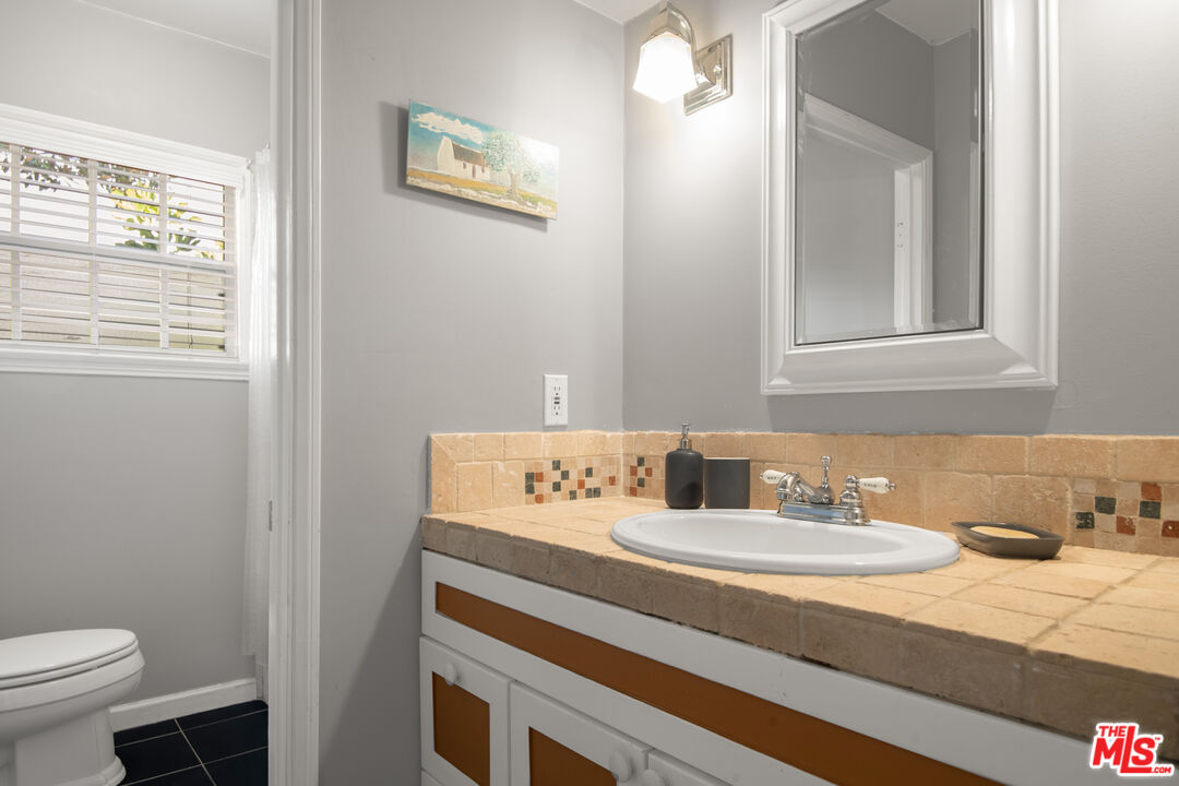 6218 Balcom Avenue Encino, CA 91316 - Photo 10 of 22 a bathroom with a sink and a toilet
