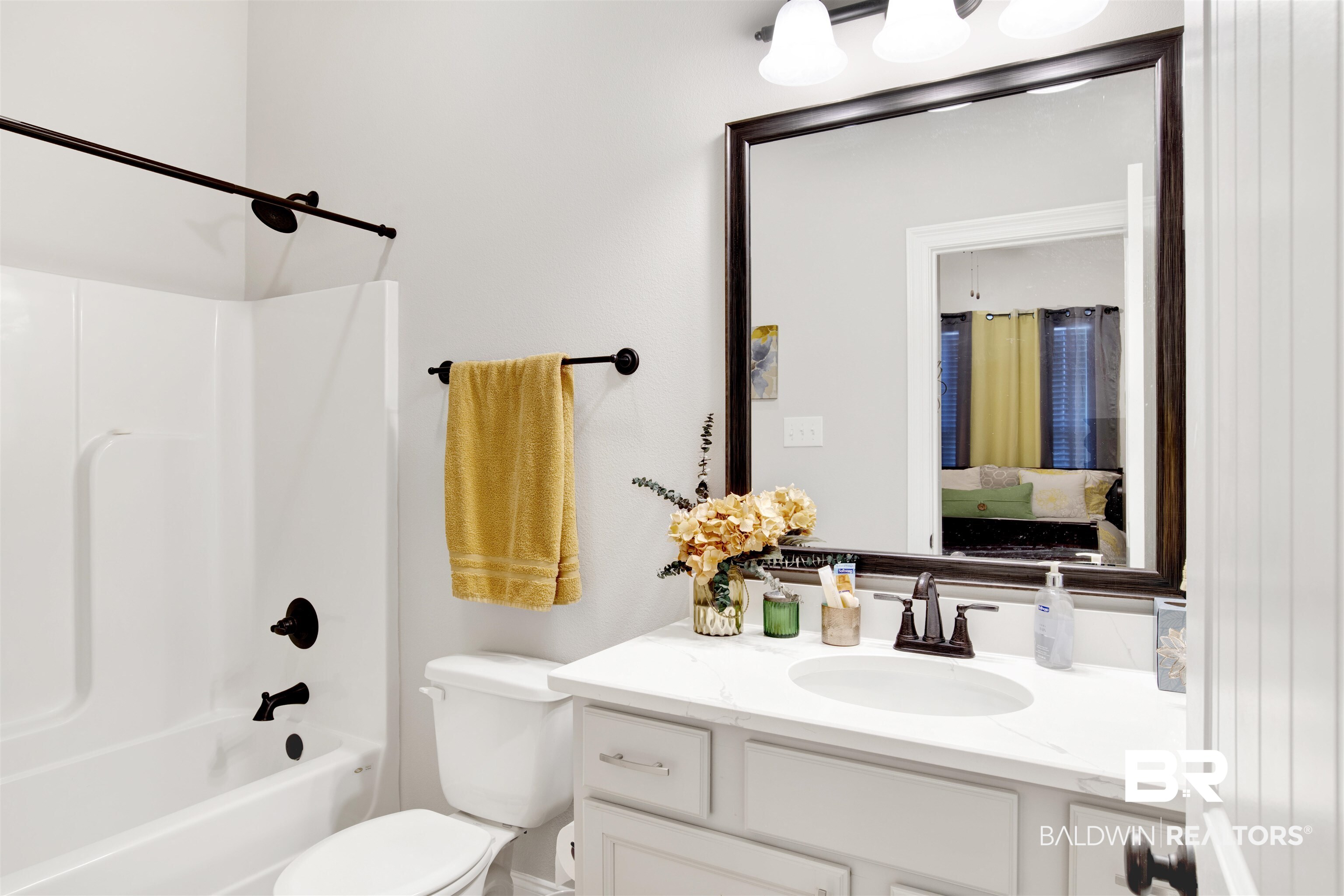 1406 Aldon Street Foley, AL 36535 - Photo 18 of 30 Full bathroom featuring toilet, vanity, and washtub / shower combination