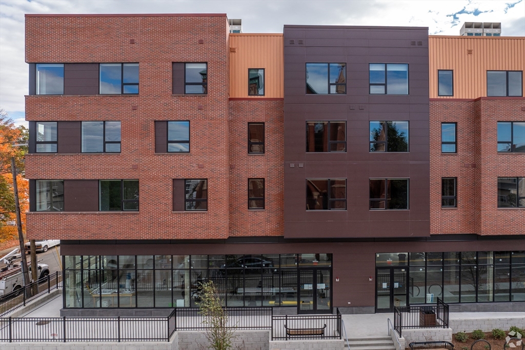 45 East Central Street, Unit 210 Natick, MA 01760 - Photo 1 of 16 a front view of a building with glass windows