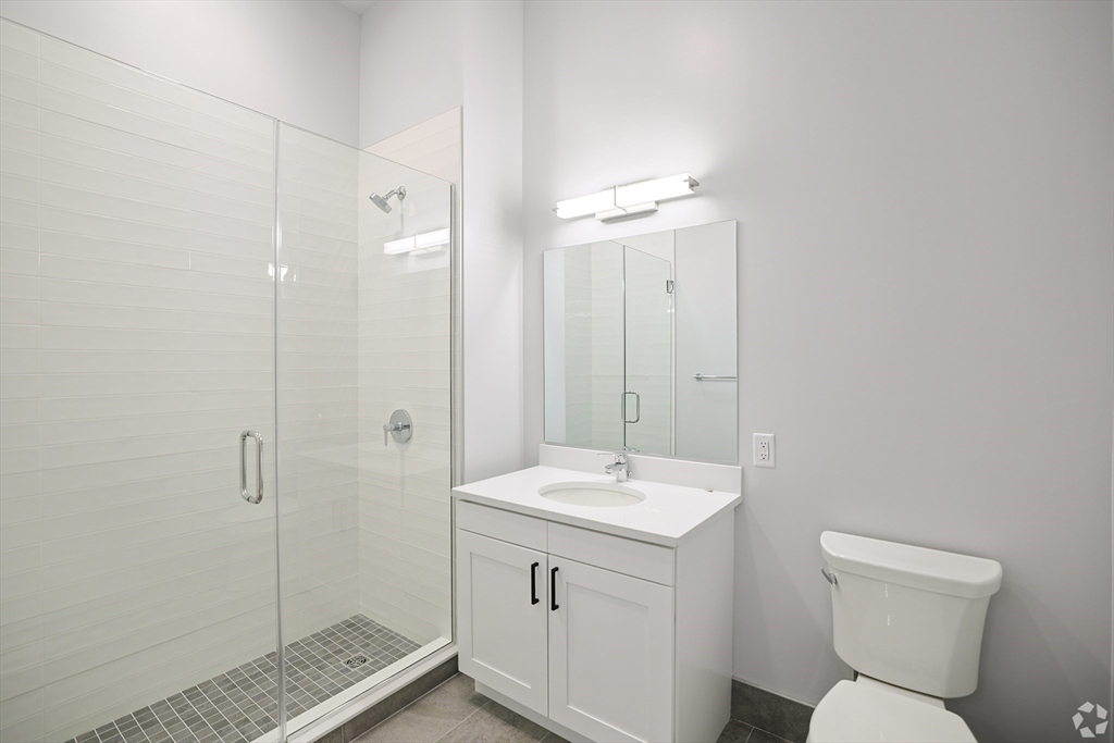 45 East Central Street, Unit 210 Natick, MA 01760 - Photo 7 of 16 a bathroom with a toilet sink and shower