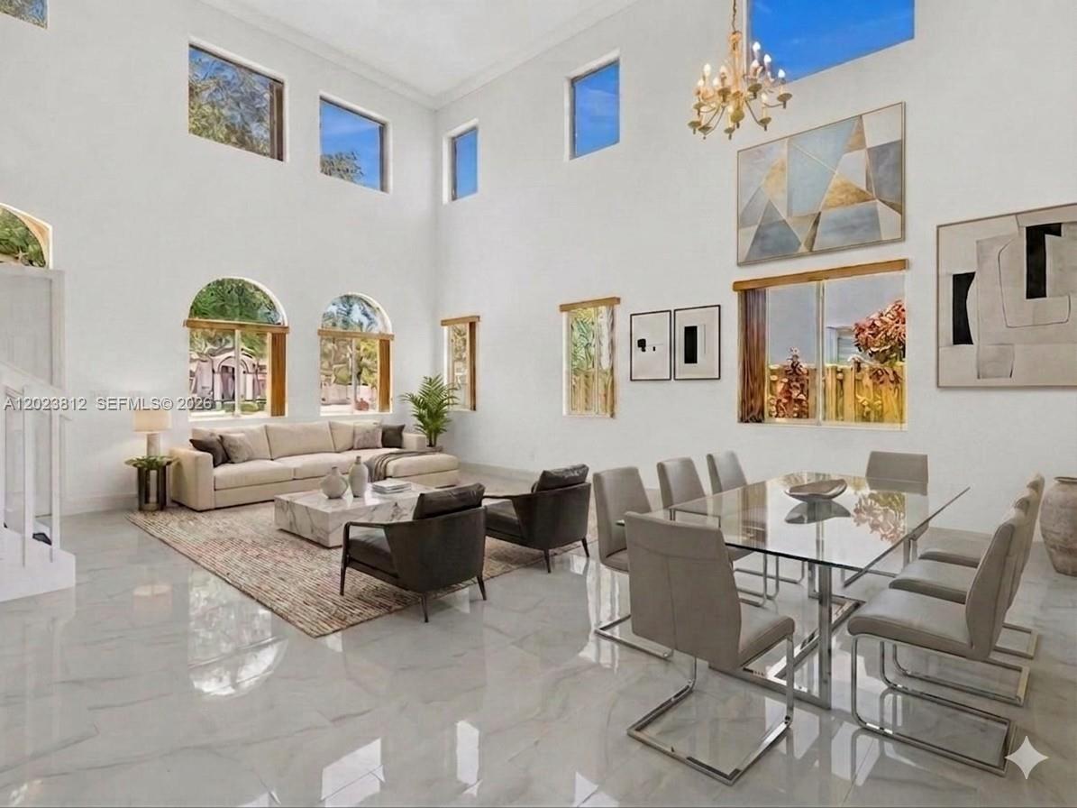 2864 Southwest 138th Path Miami, FL 33175 - Photo 6 of 40 a living room with furniture and a large window