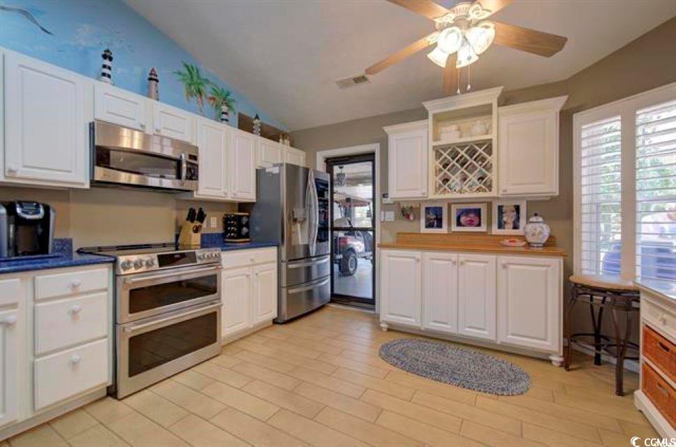 901 Southwind Court Murrells Inlet, SC 29576 - Photo 8 of 36 Kitchen with ceiling fan, appliances with stainles