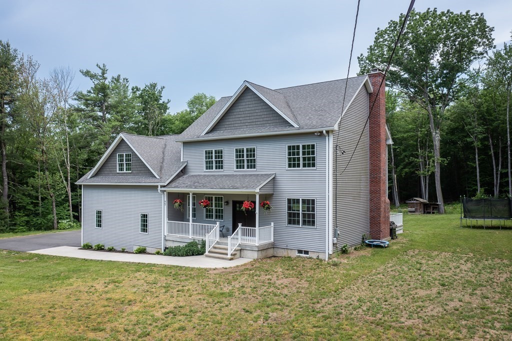 77 Jourdan Road Montgomery, MA 01085 - Photo 1 of 42 a front view of a house with garden
