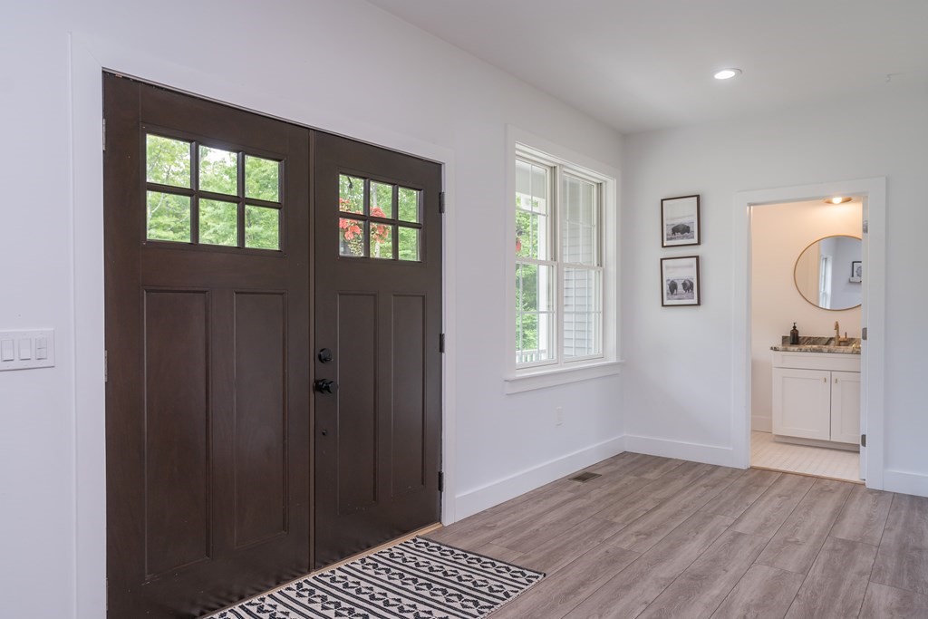 77 Jourdan Road Montgomery, MA 01085 - Photo 14 of 42 wooden floor in an empty room with a window