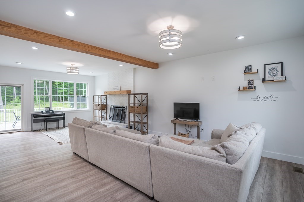 77 Jourdan Road Montgomery, MA 01085 - Photo 15 of 42 a living room with furniture and a flat screen tv