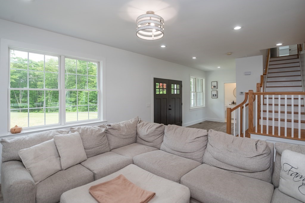 77 Jourdan Road Montgomery, MA 01085 - Photo 16 of 42 a living room with furniture and a window