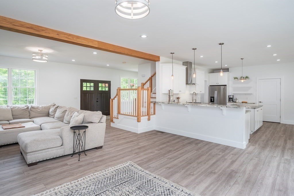 77 Jourdan Road Montgomery, MA 01085 - Photo 19 of 42 a living room with furniture and kitchen view
