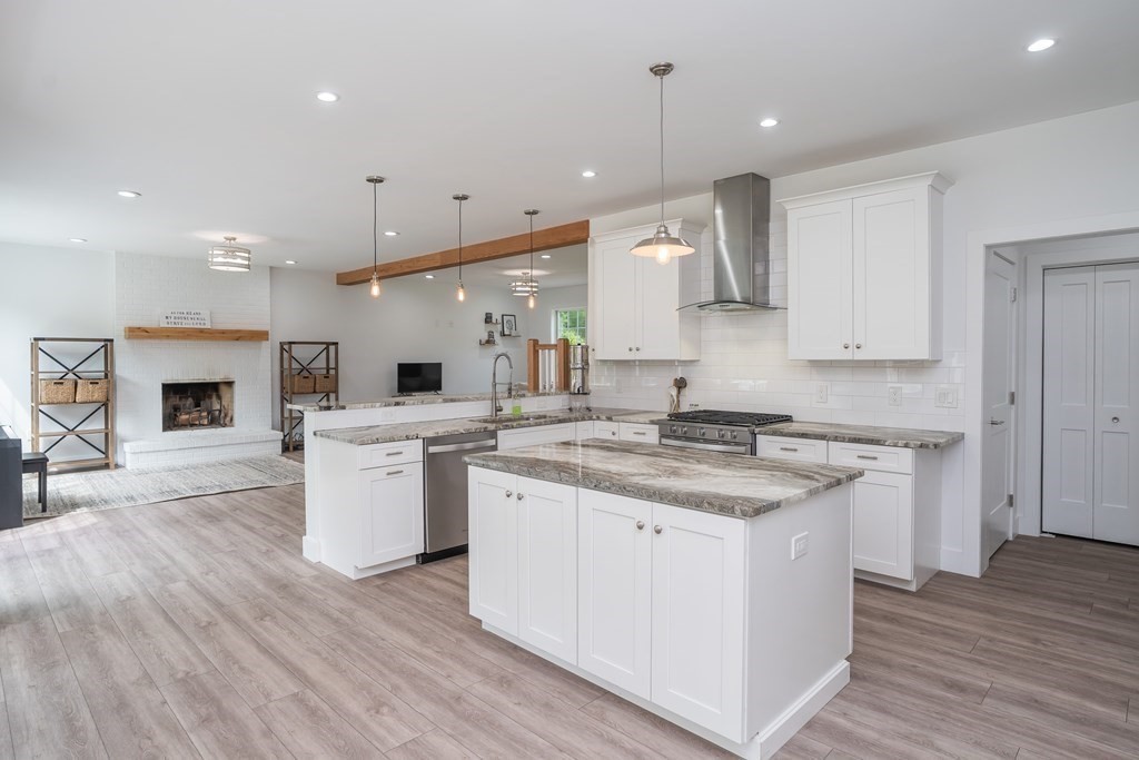 77 Jourdan Road Montgomery, MA 01085 - Photo 21 of 42 a large kitchen with kitchen island a sink a center island and stainless steel appliances