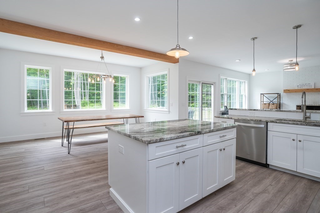 77 Jourdan Road Montgomery, MA 01085 - Photo 24 of 42 a kitchen with center island and wooden floors
