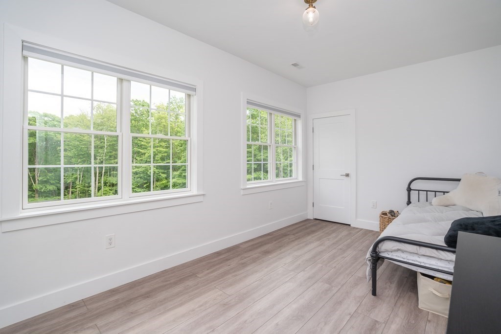 77 Jourdan Road Montgomery, MA 01085 - Photo 39 of 42 a bedroom with a bed and a window