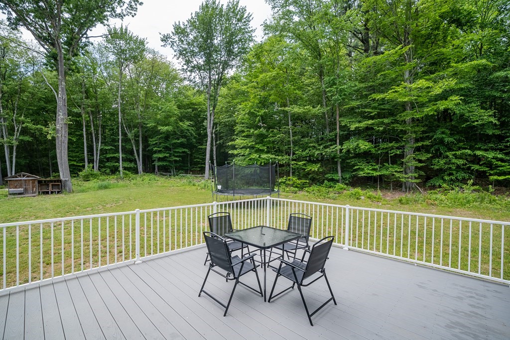 77 Jourdan Road Montgomery, MA 01085 - Photo 6 of 42 a view of a chair and table on the deck