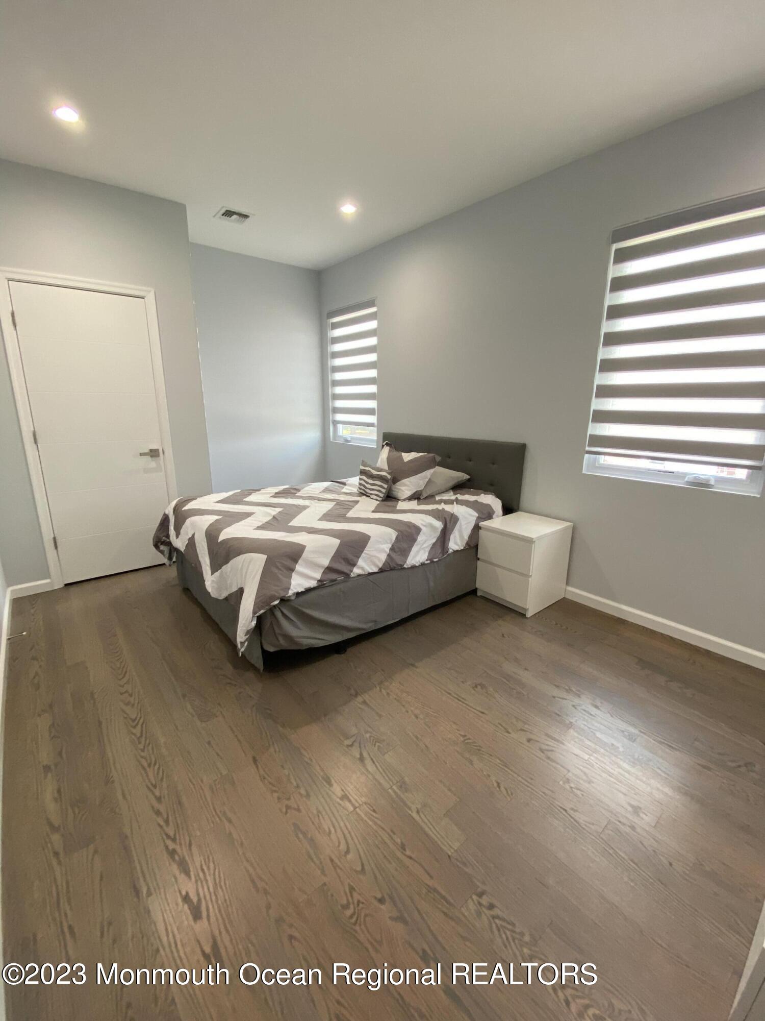 975 Van Ct Avenue Long Branch, NJ 07740 - Photo 11 of 16 a spacious bedroom with a bed and window