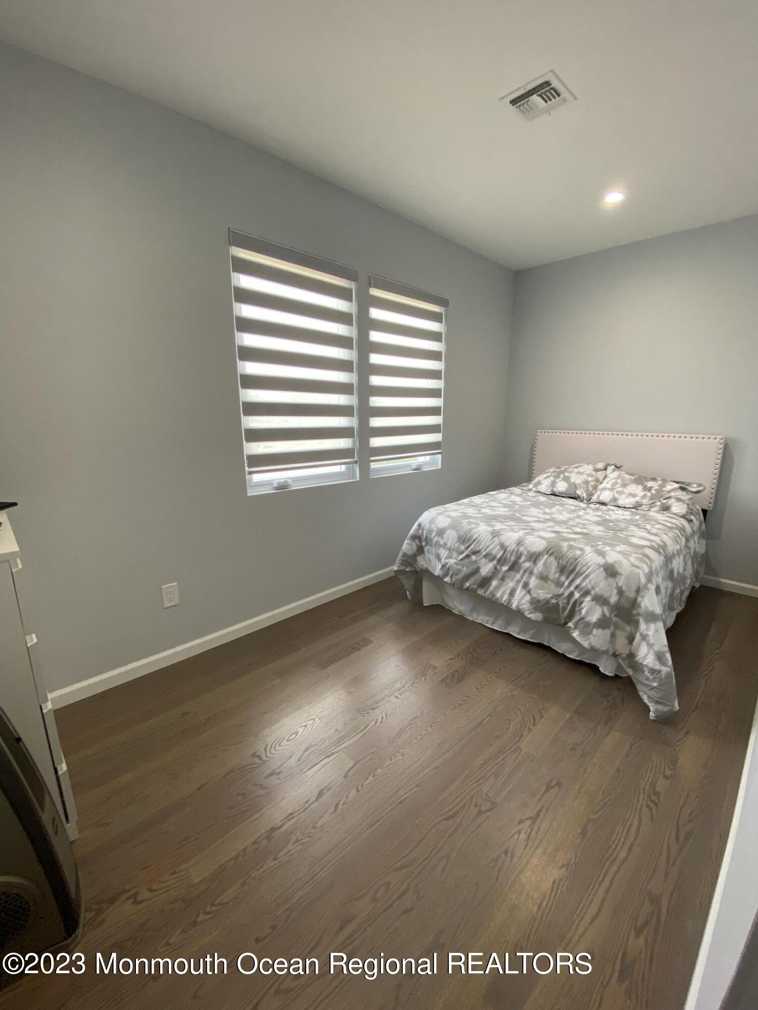 975 Van Ct Avenue Long Branch, NJ 07740 - Photo 13 of 16 a bedroom with a bed and a window