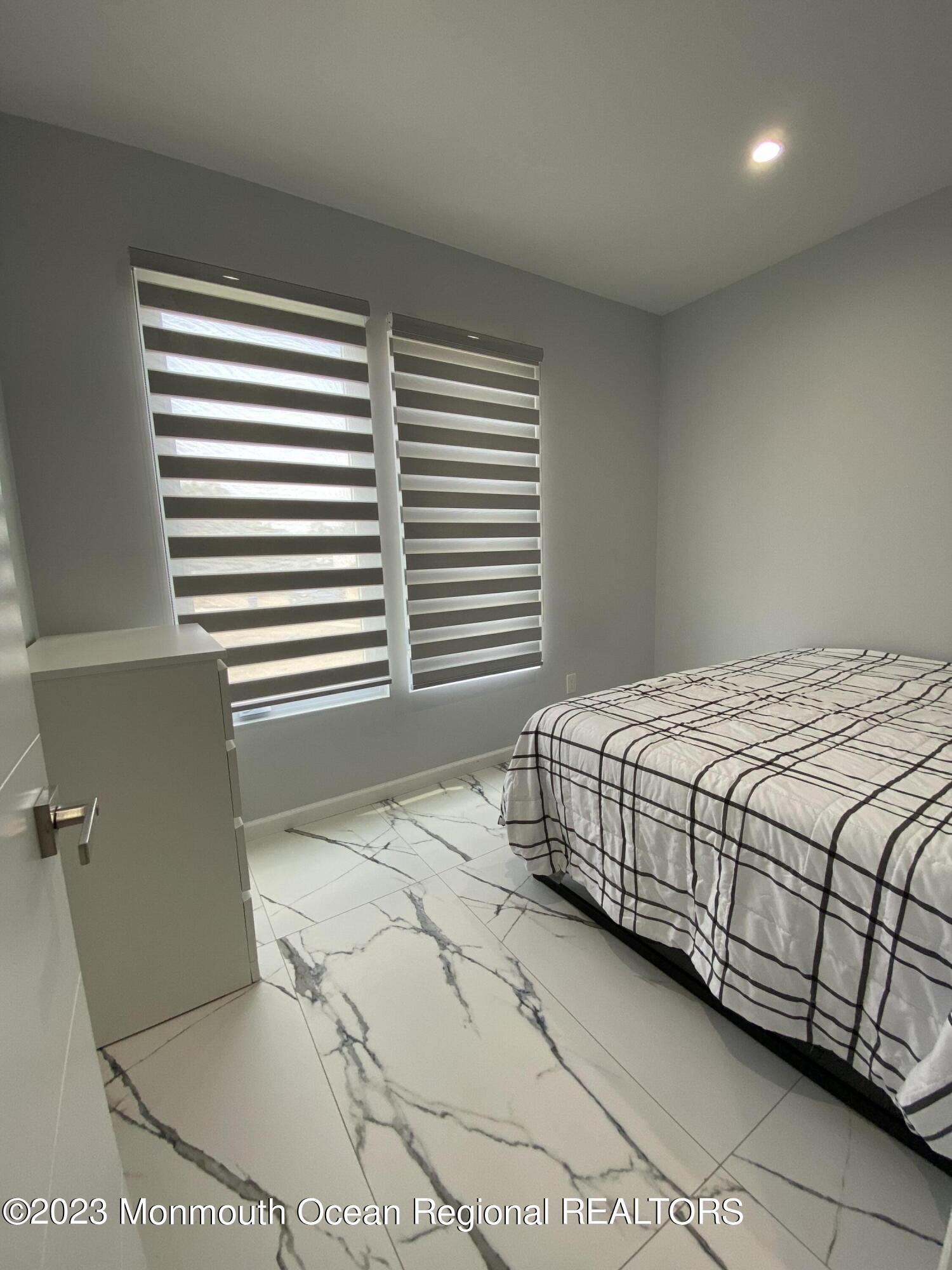 975 Van Ct Avenue Long Branch, NJ 07740 - Photo 14 of 16 a bedroom with a bed and a window