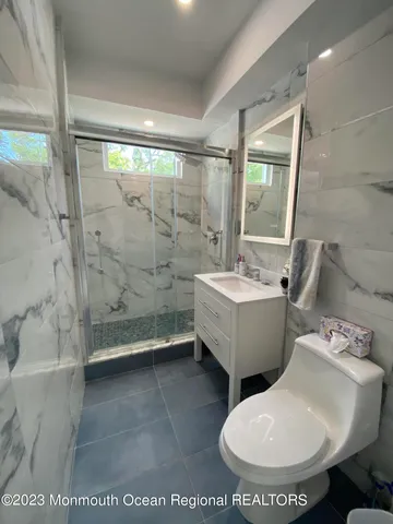 a bathroom with a toilet sink and bathtub