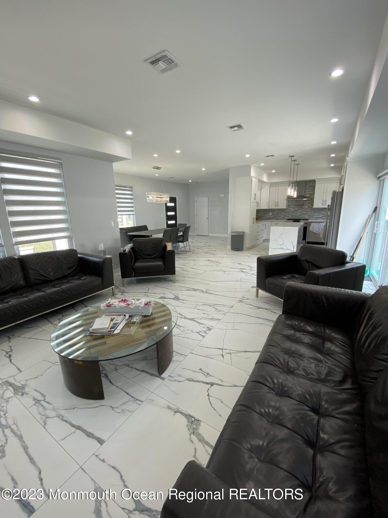 975 Van Ct Avenue Long Branch, NJ 07740 - Photo 4 of 16 a living room with furniture and a couch