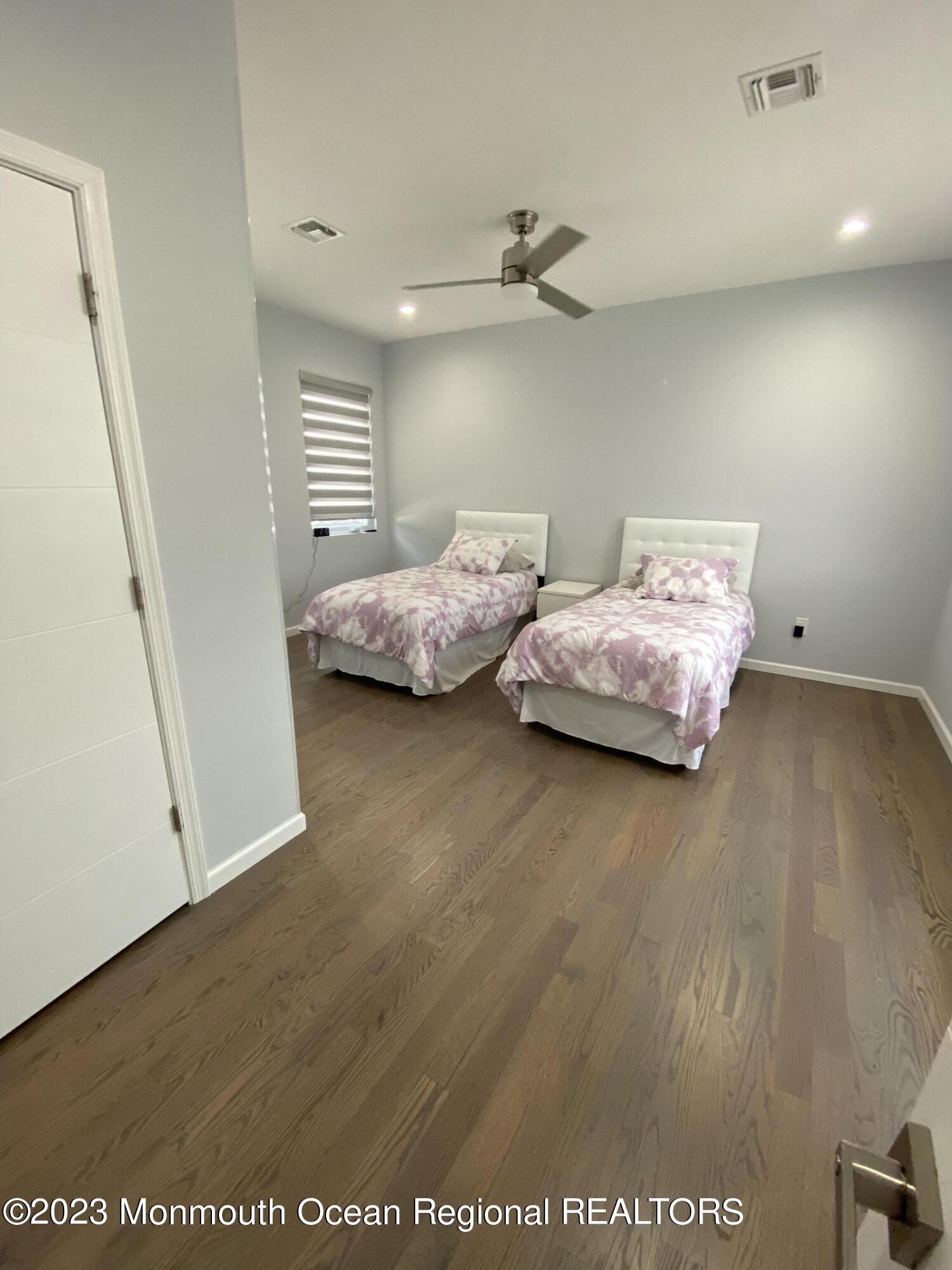 975 Van Ct Avenue Long Branch, NJ 07740 - Photo 8 of 16 a bedroom with bed and a window