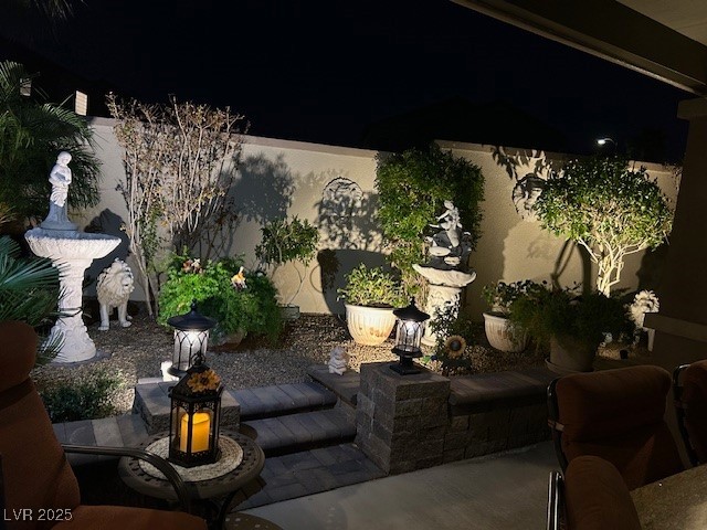 8175 Arville Street, Unit 210 Las Vegas, NV 89139 - Photo 4 of 36 Patio at night with a patio area
