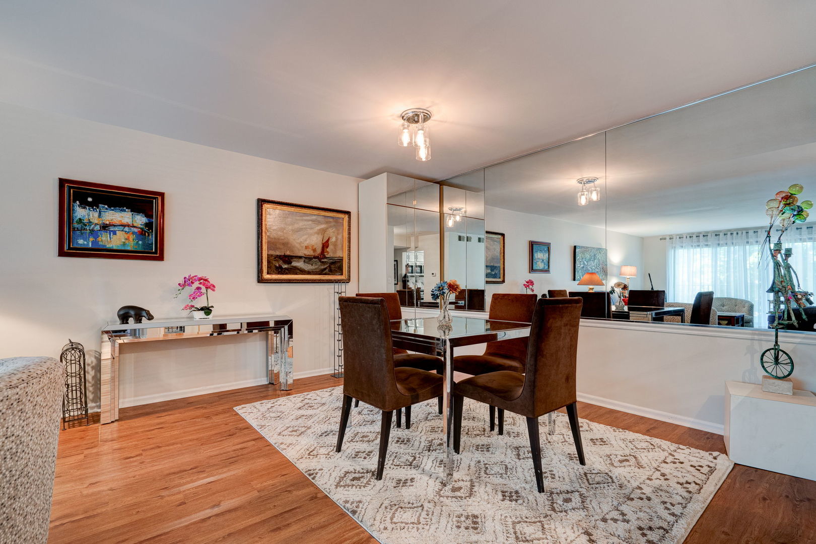 1-s150 Spring Road, Unit 2B Oak Brook, IL 60181 - Photo 3 of 10 a view of a dining room with furniture and a livingroom