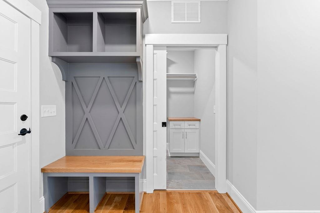 5301 Banks Rose Way Raleigh, NC 27603 - Photo 25 of 37 With custom cubbies and laundry just beyond with cabinets! Mudroom