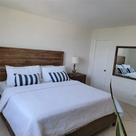 a bathroom with a sink vanity and mirror