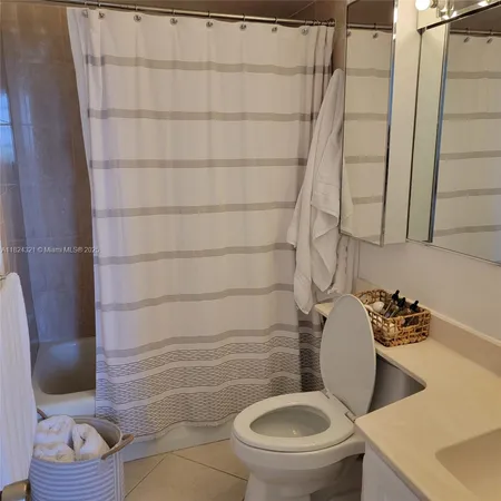 a view of a chairs and bench in a balcony