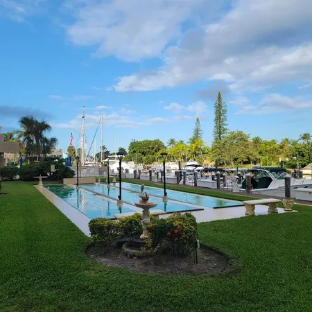 a view of a swimming pool with a lounge chairs