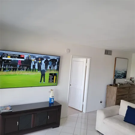 a living room with a couch and a flat screen tv