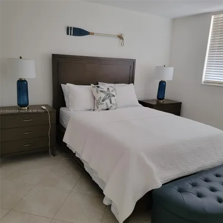 a bedroom with a bed and walk in closet