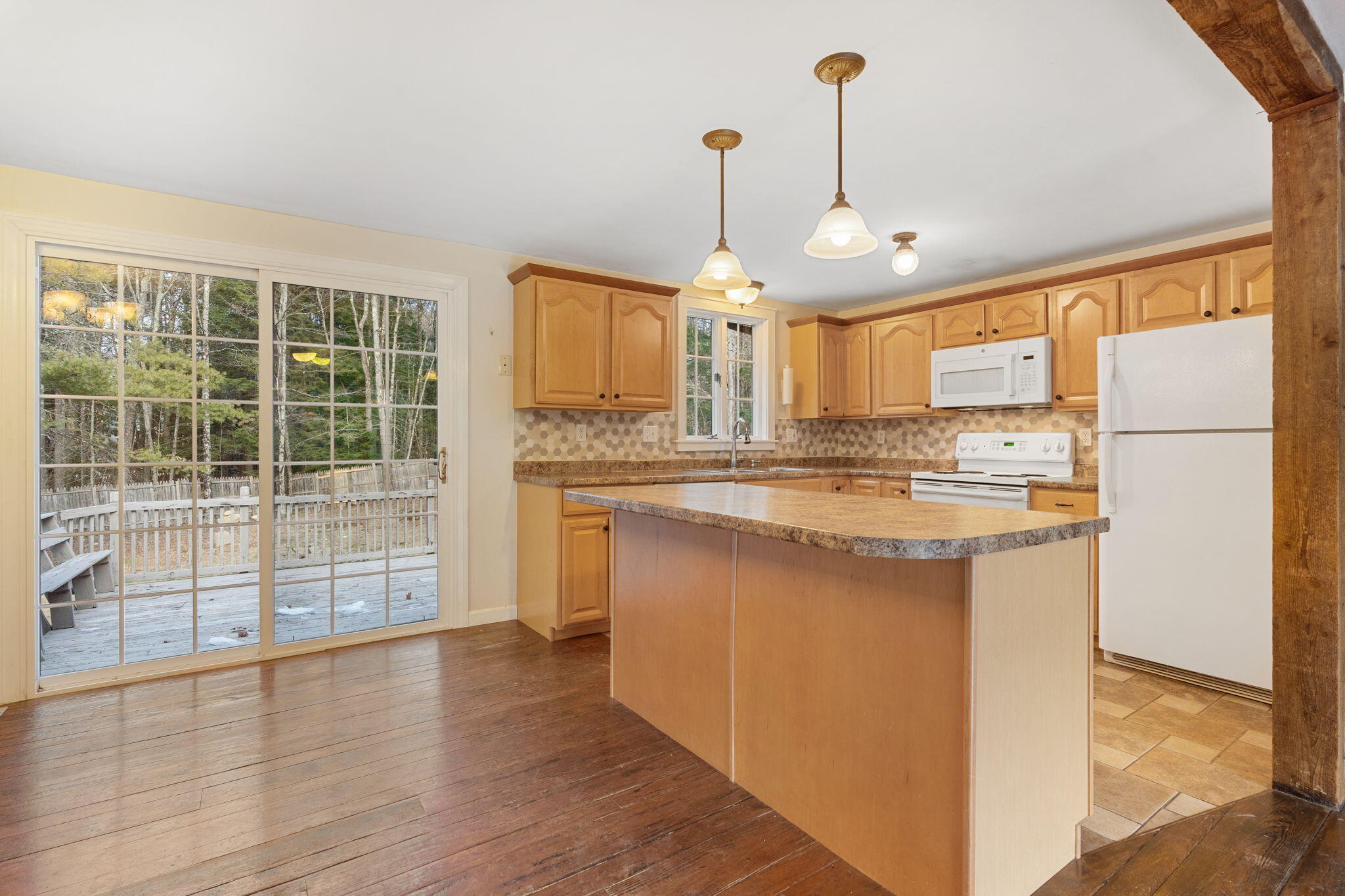 91 Chandler Road New Gloucester, ME 04260 - Photo 17 of 45 Kitchen and Sliding Glass Door to Deck