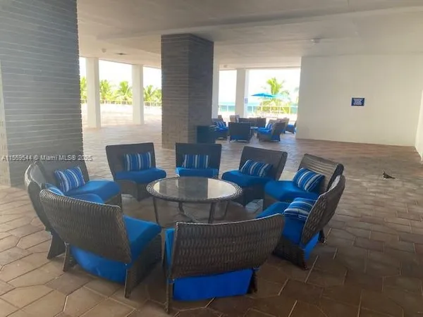 a dining room with furniture a window and a table