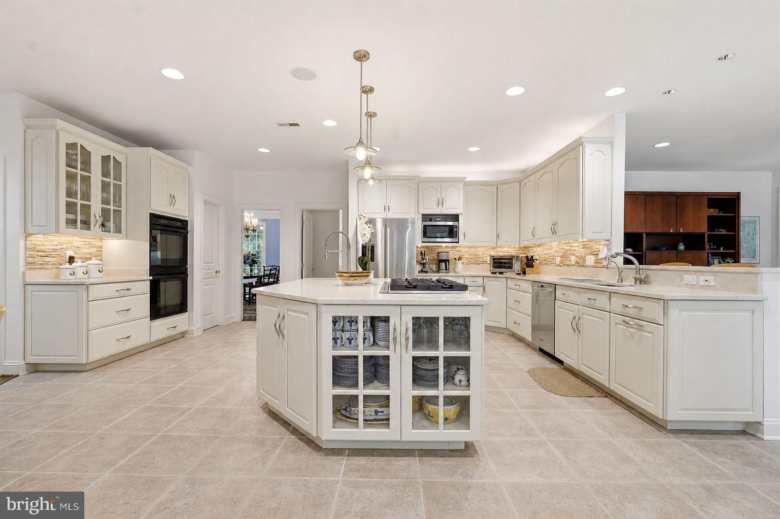 11640 Piney Spring Lane Potomac, MD 20854 - Photo 9 of 38 Chef's Gourmet Kitchen with Ample Cabinetry & Brea