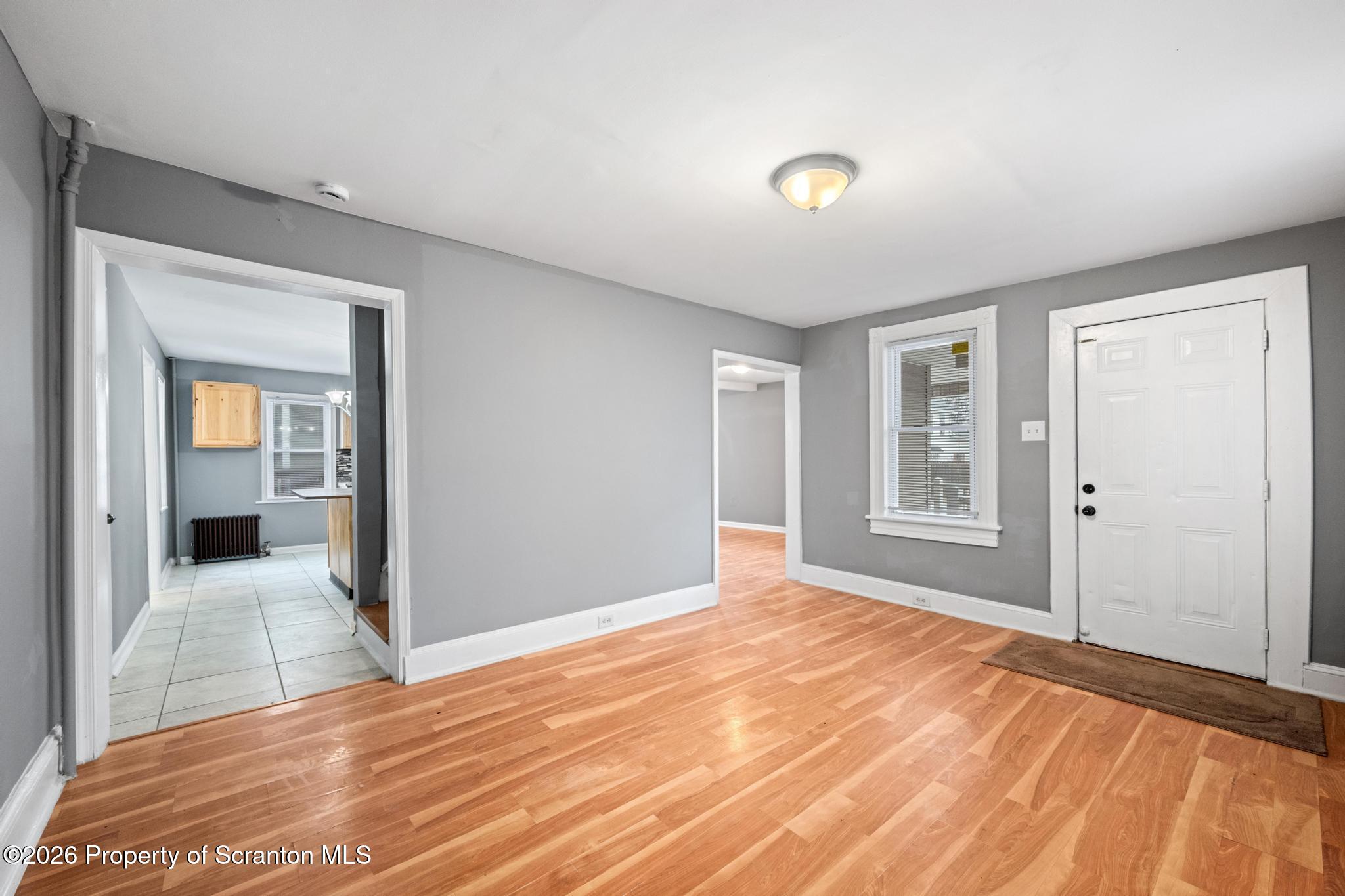 2717 North Main Avenue Scranton, PA 18508 - Photo 12 of 36 a view of a livingroom with wooden floor and a bathroom