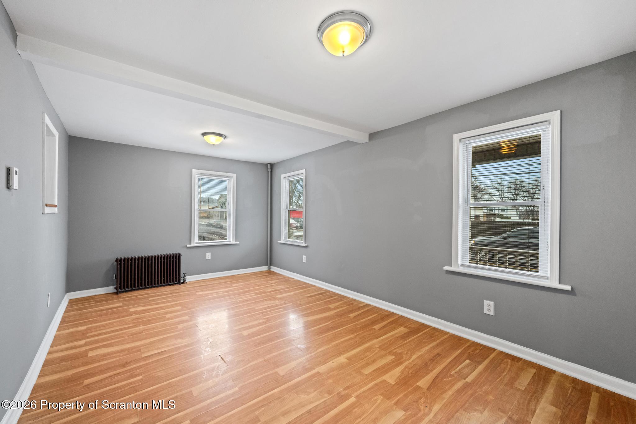 2717 North Main Avenue Scranton, PA 18508 - Photo 19 of 36 a bedroom with a bed and window