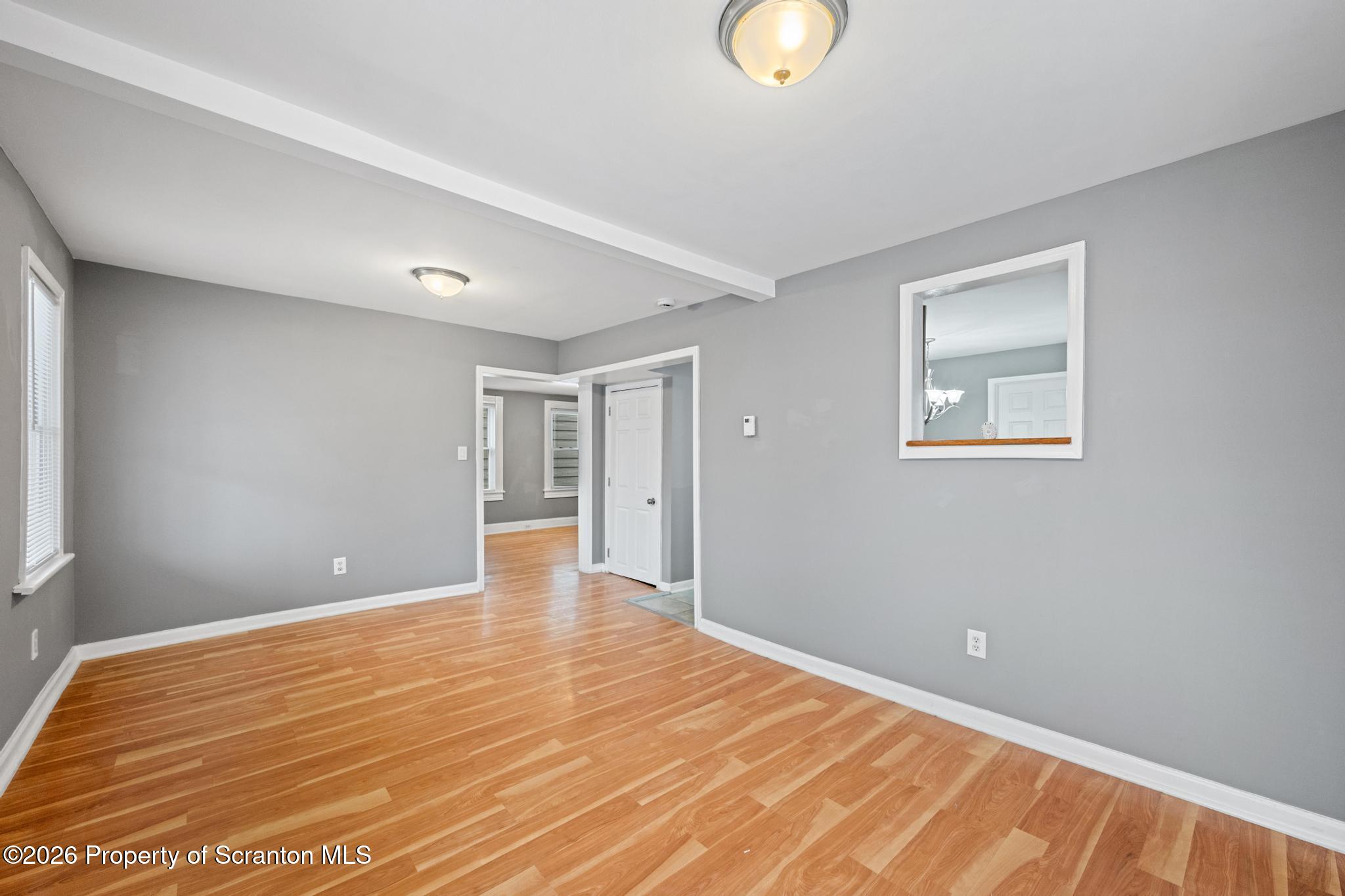 2717 North Main Avenue Scranton, PA 18508 - Photo 20 of 36 a view of an empty room with wooden floor and a window