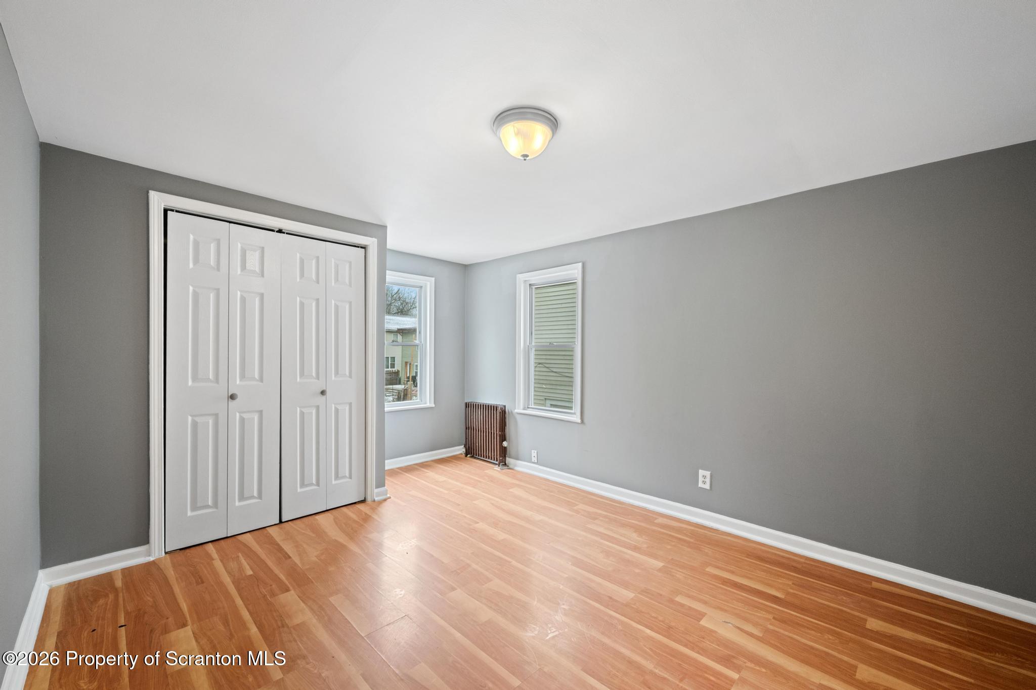 2717 North Main Avenue Scranton, PA 18508 - Photo 25 of 36 a view of a livingroom with wooden floor and window