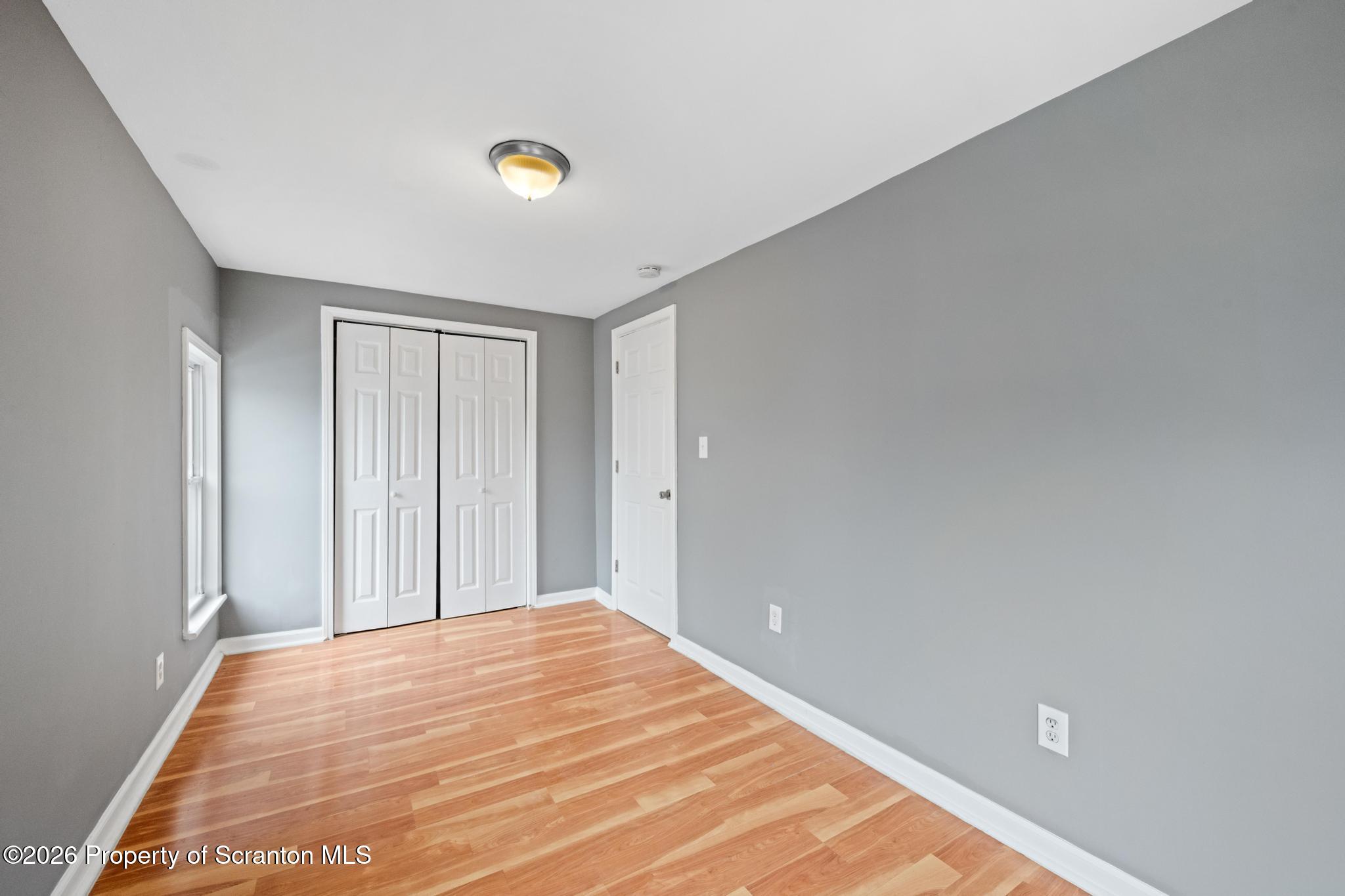 2717 North Main Avenue Scranton, PA 18508 - Photo 32 of 36 a view of a room with a wooden floor and white walls