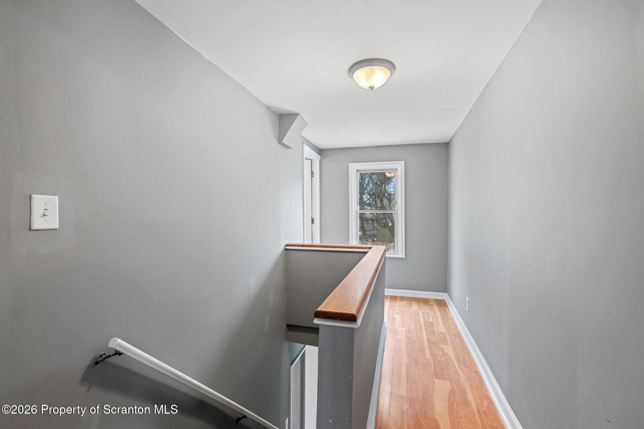 2717 North Main Avenue Scranton, PA 18508 - Photo 33 of 36 a view of a hallway with wooden floor