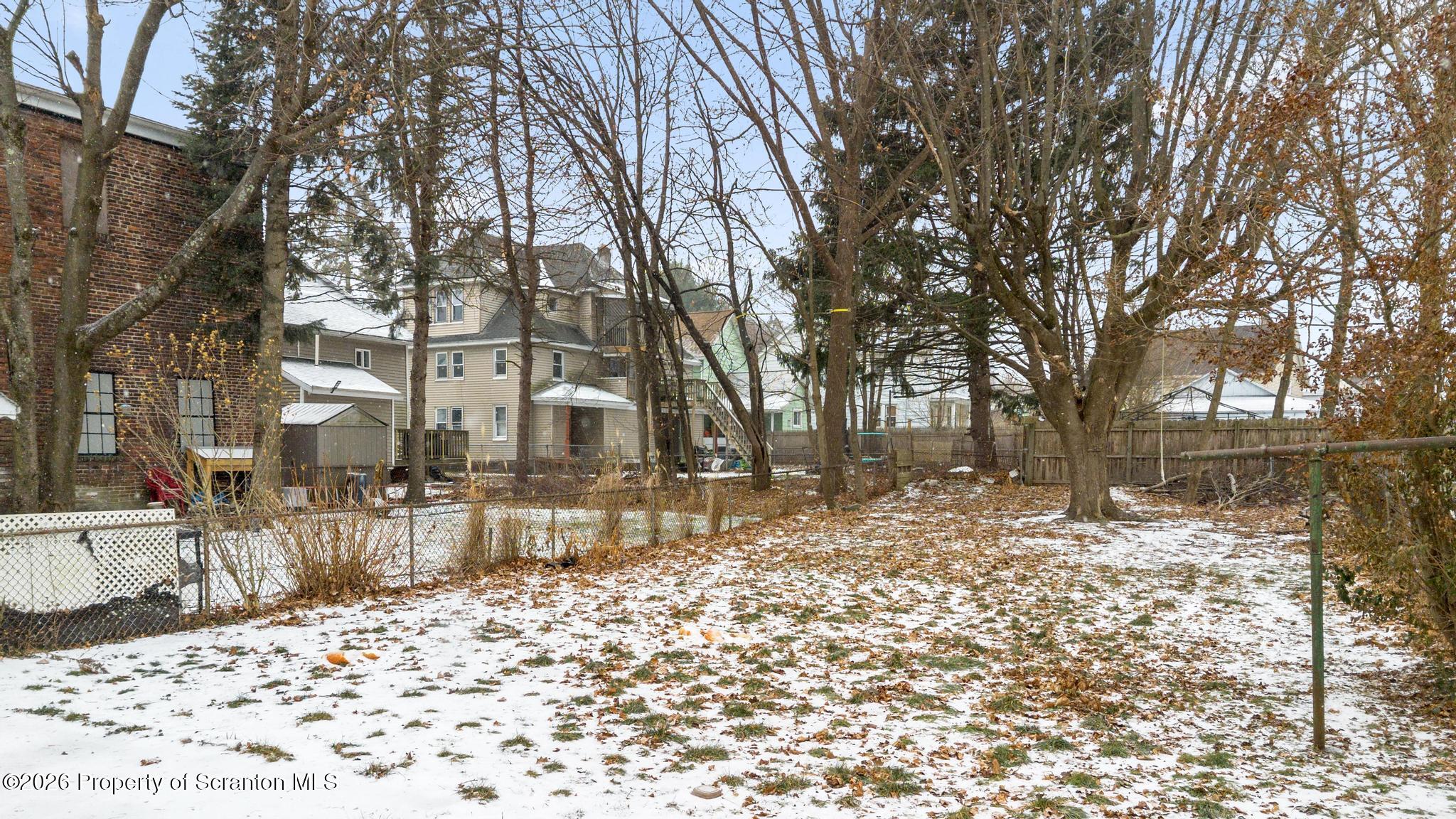 2717 North Main Avenue Scranton, PA 18508 - Photo 5 of 36 a view of a yard with snow on the road