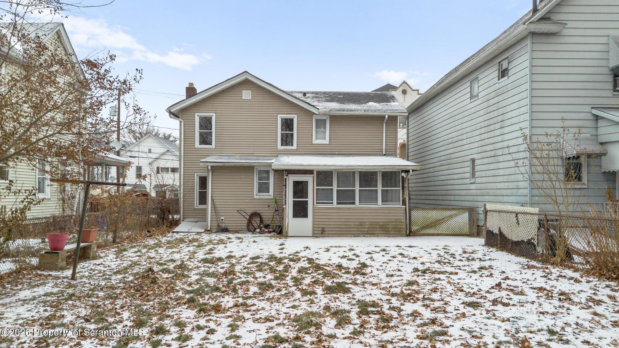 2717 North Main Avenue Scranton, PA 18508 - Photo 6 of 36 a front view of a house with a yard