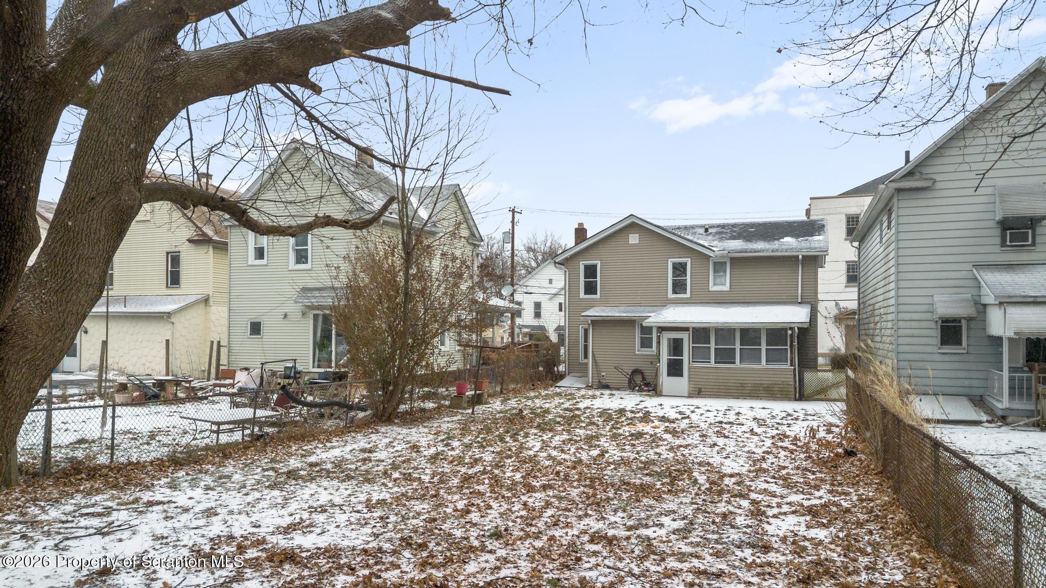 2717 North Main Avenue Scranton, PA 18508 - Photo 7 of 36 a front view of a house with a yard