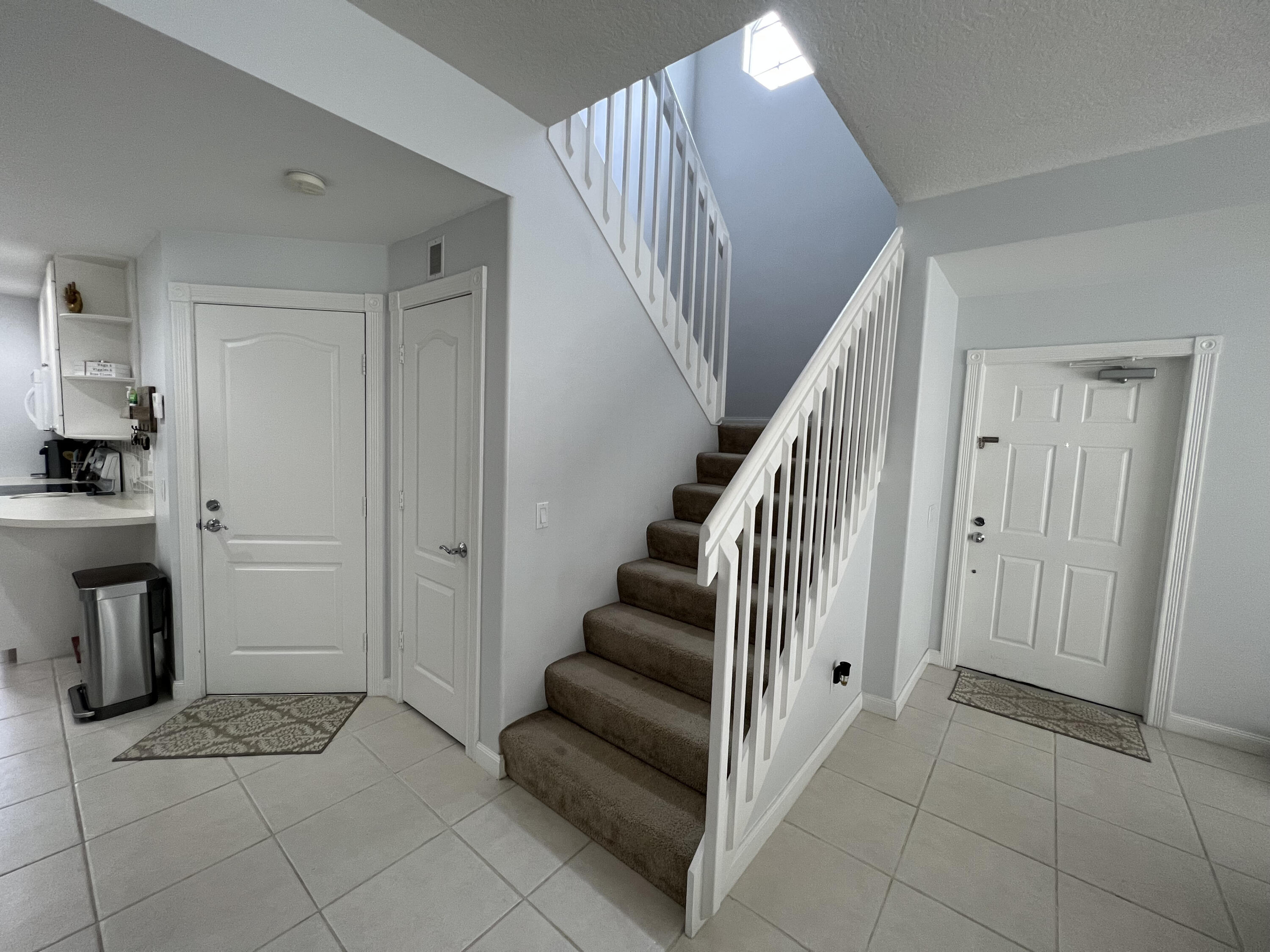 482 Capistrano Drive Palm Beach Gardens, FL 33410 - Photo 7 of 9 a view of entryway and hall with a window