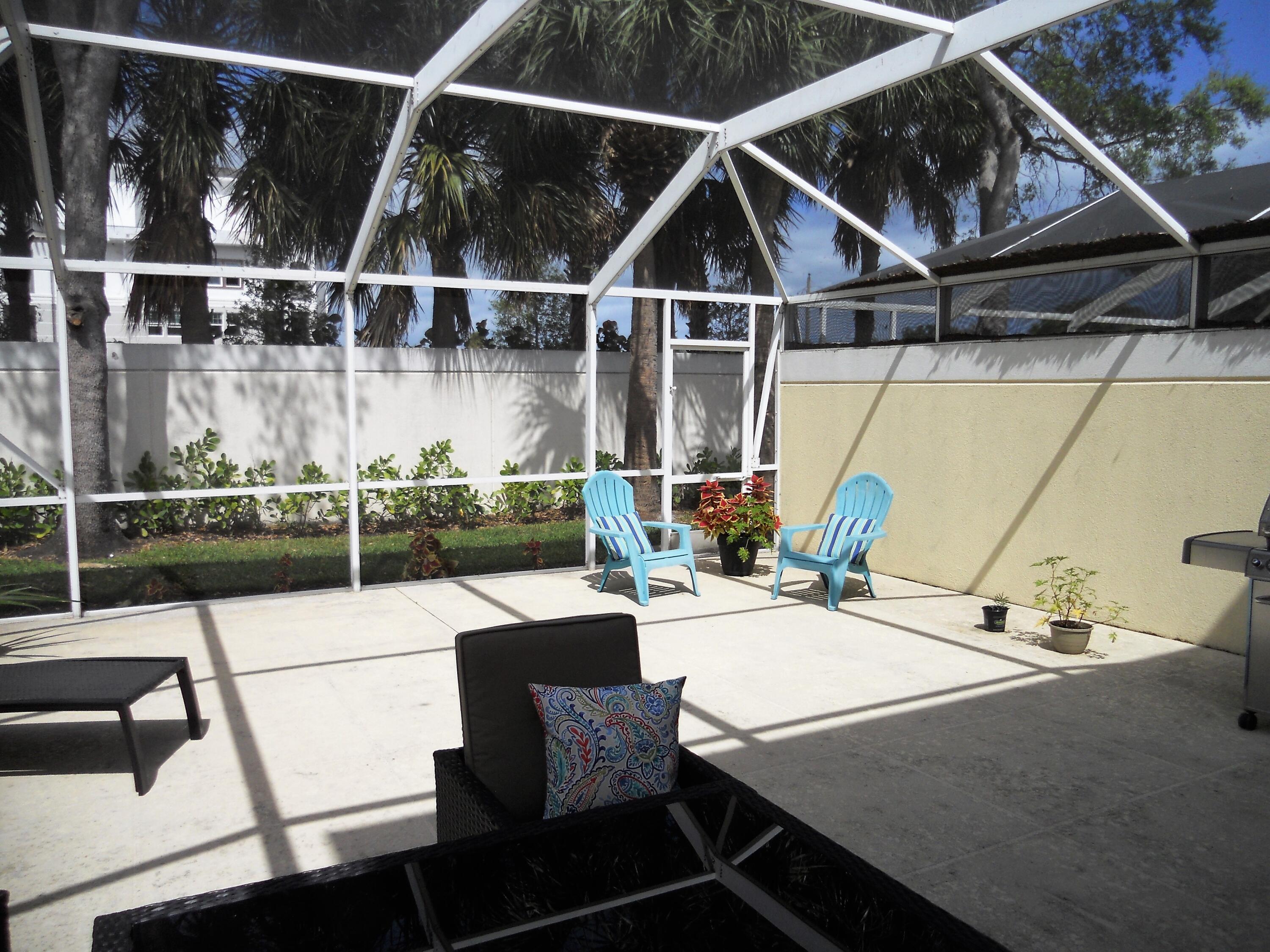482 Capistrano Drive Palm Beach Gardens, FL 33410 - Photo 9 of 9 a view of a patio with table and chairs