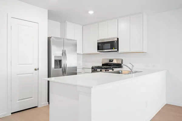a bathroom with a sink a mirror and a shower